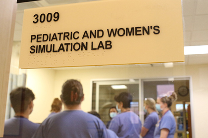 Medical students meet in the Pediatric and Women's Simulation Lab