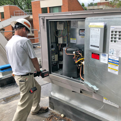 Robbie Kincaid working in a utility box