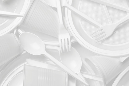 Layers of white plastic utensils