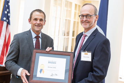 President Ryan presenting an award to Mike Duffy